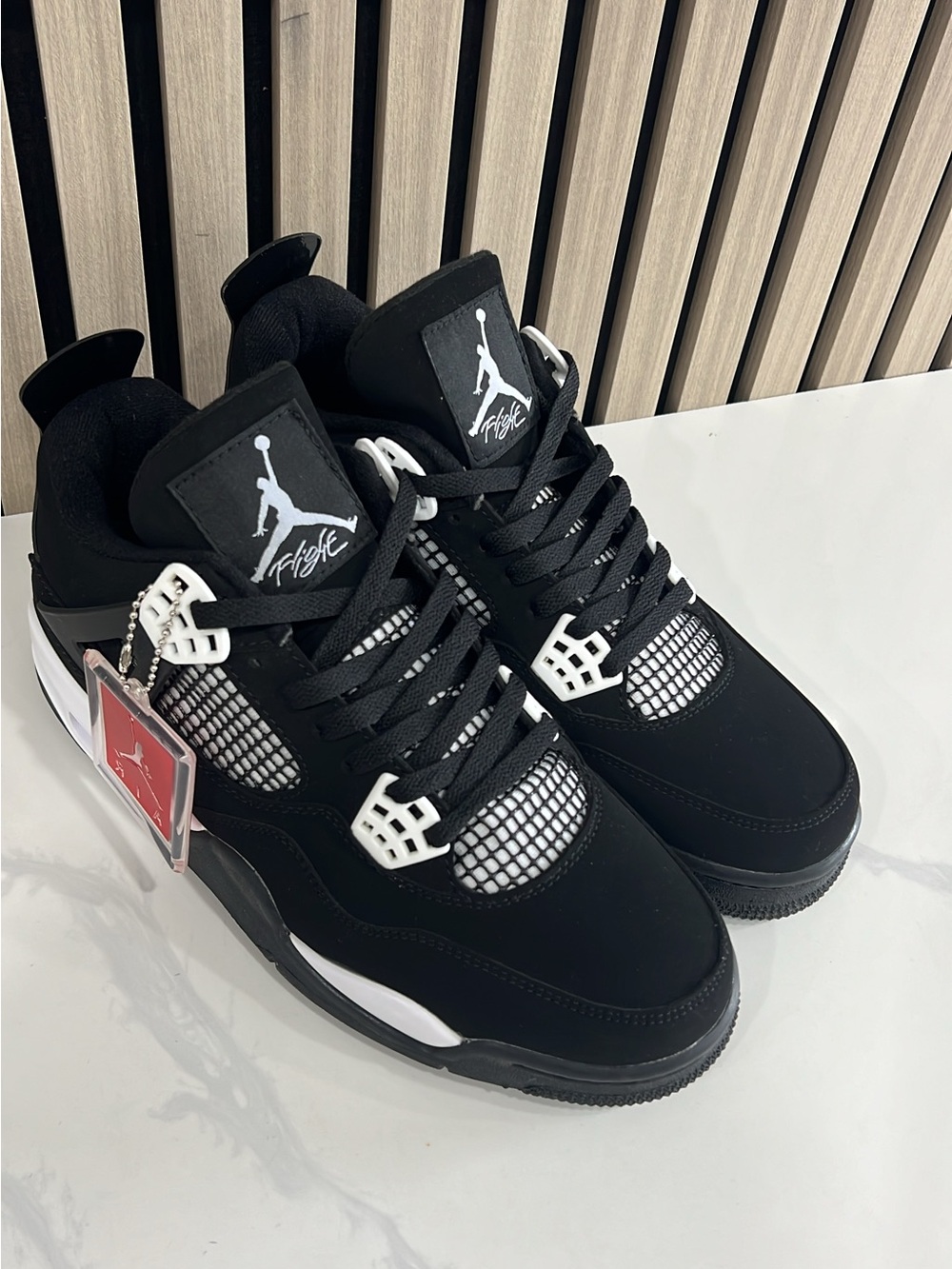 Jordan Black and White Retro 4 Low Sneakers